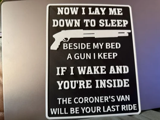 Now I lay me down to sleep beside my bed a gun I keep - Sign